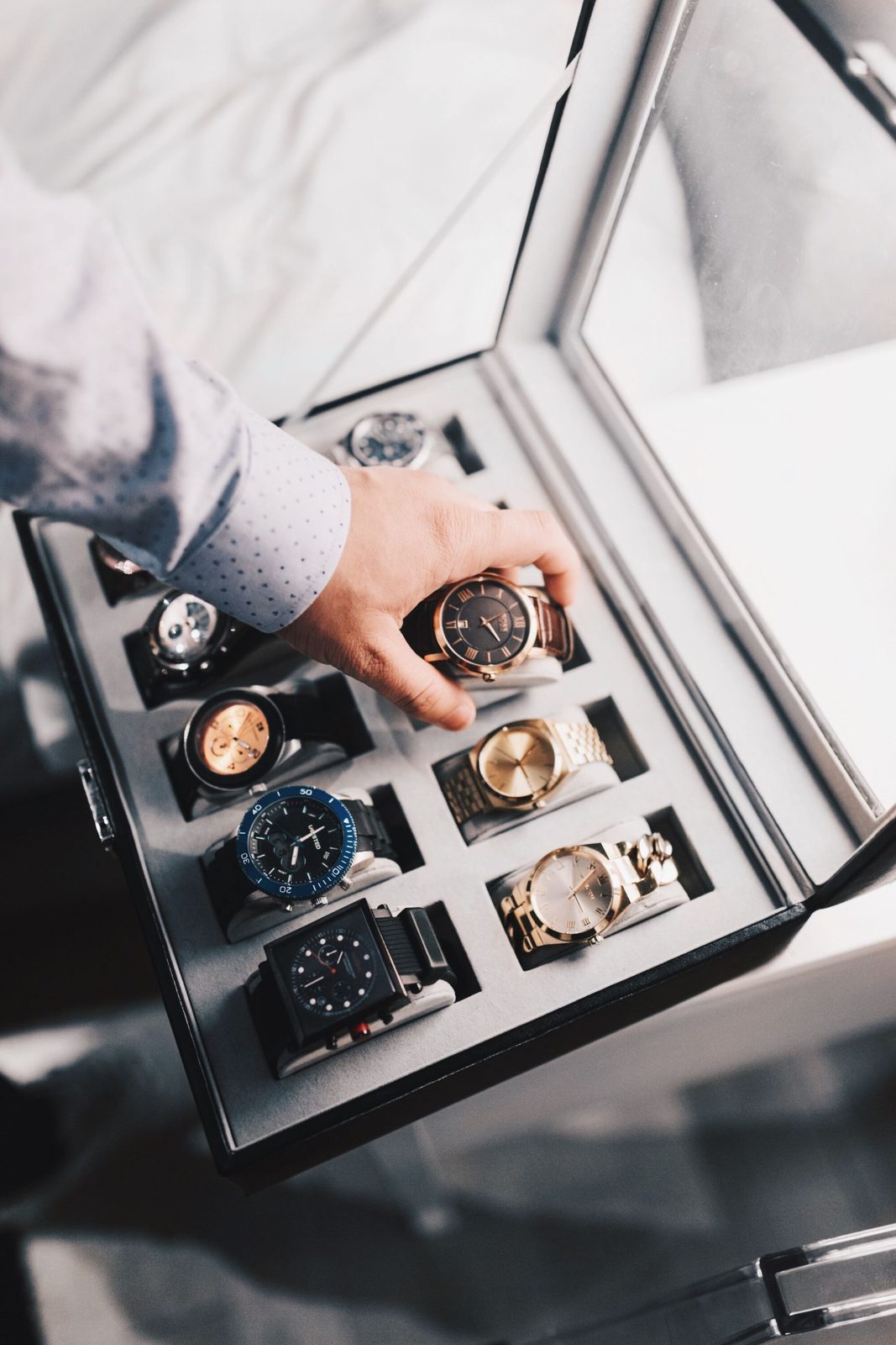 A collection of luxury watches in a display box